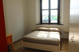 Postel nebo postele na pokoji v ubytování Student's Hostel Parma