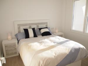 En eller flere senge i et værelse på GRAND PAVOIS 37