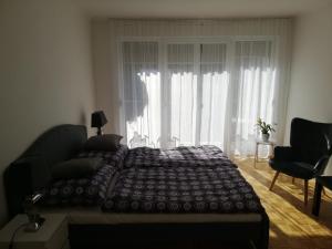 Postel nebo postele na pokoji v ubytování Apartment Graz Lustbuhel