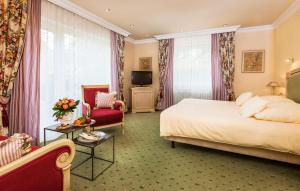 Voodi või voodid majutusasutuse Relais & Châteaux Hotel Schwarzmatt toas