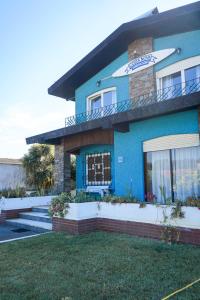 a blue building with a sign on top of it at Costanova Surfhouse in Ílhavo