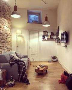 a living room with a couch and a table at Lovely Home Marta in Pozzuoli