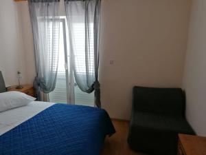 Postel nebo postele na pokoji v ubytování Apartment and room Gušćić