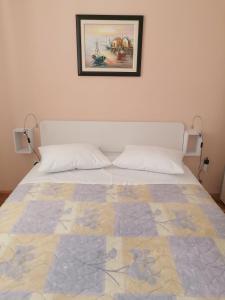 Postel nebo postele na pokoji v ubytování Apartment and room Gušćić