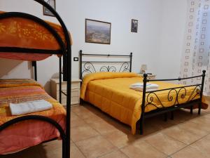 Giường trong phòng chung tại Casale Rurale