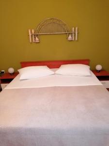 Postel nebo postele na pokoji v ubytování Apartment and room Gušćić