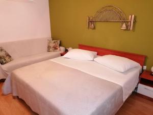Postel nebo postele na pokoji v ubytování Apartment and room Gušćić