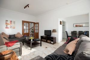 A television and/or entertainment centre at Villa Calma by Villa Plus
