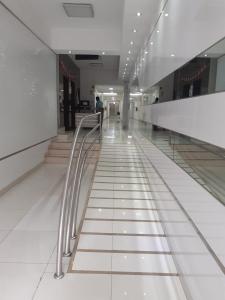 a hallway of a shopping mall with a metal railing at LOVENEST in Lima