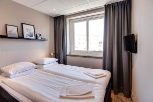 Voodi või voodid majutusasutuse Karlskrona H&H toas