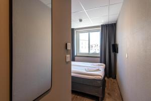 Voodi või voodid majutusasutuse Karlskrona H&H toas