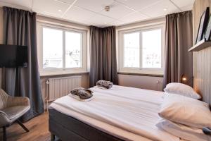 Postel nebo postele na pokoji v ubytování Karlskrona H&H