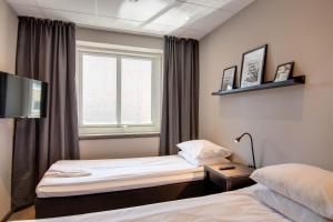 Voodi või voodid majutusasutuse Karlskrona H&H toas