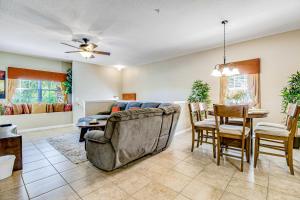 a living room with a couch and a table at Oakwater Resort Cheshire Nook in Orlando