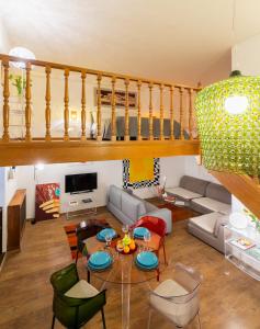 a living room with a couch and a table at Rotonda 23 - Loft in Pantheon in Rome