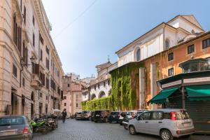 a city street with cars parked on the street at Rotonda 23 - Loft in Pantheon in Rome