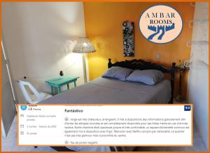 a homepage of a bedroom with a bed and a desk at AMBAR Rooms in Campeche