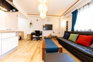 a living room with a couch and a table at BOUTOU - Vacation STAY 34136v in Tokyo