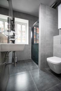 a bathroom with a sink and a toilet at Balans Studio Old Town in Gdańsk +26 photos