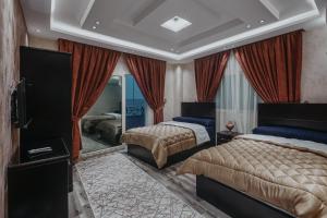 Postel nebo postele na pokoji v ubytování Pyramids Planet Hotel + 37 fotografií