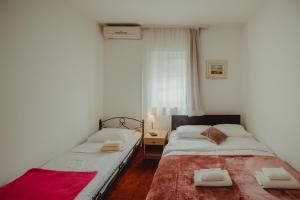 Posteľ alebo postele v izbe v ubytovaní B&B Laguna