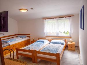 Кровать или кровати в номере Penzion U Cempu