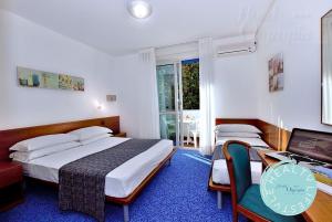 Postel nebo postele na pokoji v ubytování Hotel Olympia