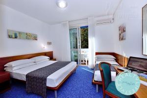 Postel nebo postele na pokoji v ubytování Hotel Olympia + 37 fotografií