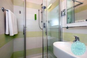 Koupelna v ubytování Hotel Olympia