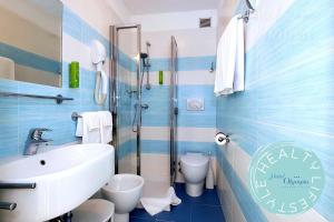 Koupelna v ubytování Hotel Olympia