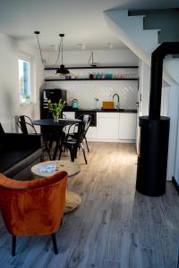 a living room with a table and a stove at Dream-House in Kopalino