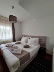 Postel nebo postele na pokoji v ubytování Apartman Ibarstar