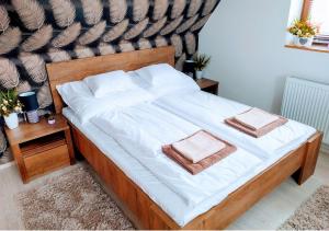 Posteľ alebo postele v izbe v ubytovaní Müezzin Apartman