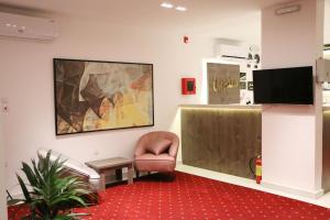 TV a/nebo společenská místnost v ubytování Mandreen Serviced Apartments