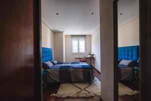 Cama o camas de una habitación en El Rosal de Oviedo
