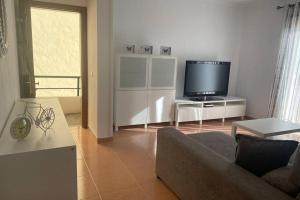 TV a/nebo společenská místnost v ubytování Apartamento Cristina 3D
