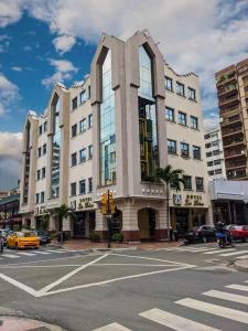 a building on the corner of a city street at Hotel Las Peñas in Guayaquil