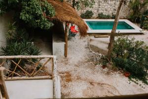 an aerial view of a house with a swimming pool at Xiknal Cozumel in Cozumel