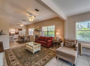 a living room with a couch and chairs and a table at Beachcomber Beach House - Weekly Rental Just Steps to White Sand Beach! home in Clearwater Beach
