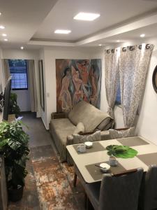 a living room with a couch and a table at Guest Apartment Paulo in Recife