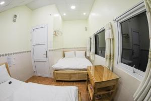 Postel nebo postele na pokoji v ubytování Tigon Flower House