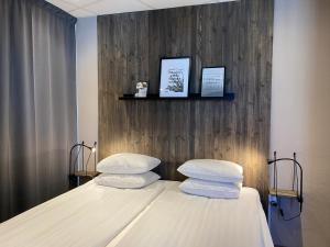 Voodi või voodid majutusasutuse Karlskrona H&H toas