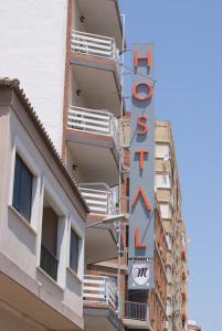a hotel sign on the side of a building at Hostal Moreno in Silla