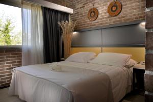 Postel nebo postele na pokoji v ubytování Hotel Marina + 37 fotografií