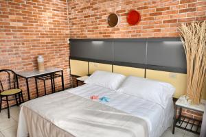 Postel nebo postele na pokoji v ubytování Hotel Marina