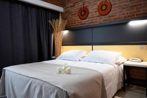 Postel nebo postele na pokoji v ubytování Hotel Marina