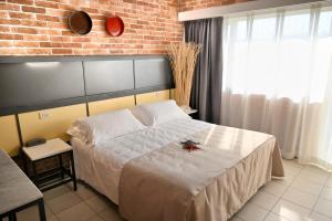 Postel nebo postele na pokoji v ubytování Hotel Marina
