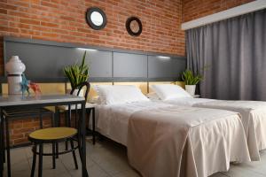 Postel nebo postele na pokoji v ubytování Hotel Marina