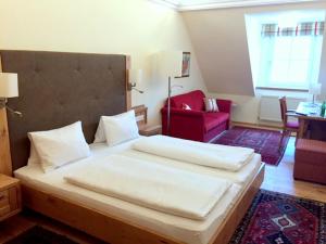 Łóżko lub łóżka w pokoju w obiekcie Hotel-Restaurant Kirchenwirt