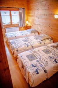 Ένα ή περισσότερα κρεβάτια σε δωμάτιο στο Le Mont Blanc (Gite Des Alpes)